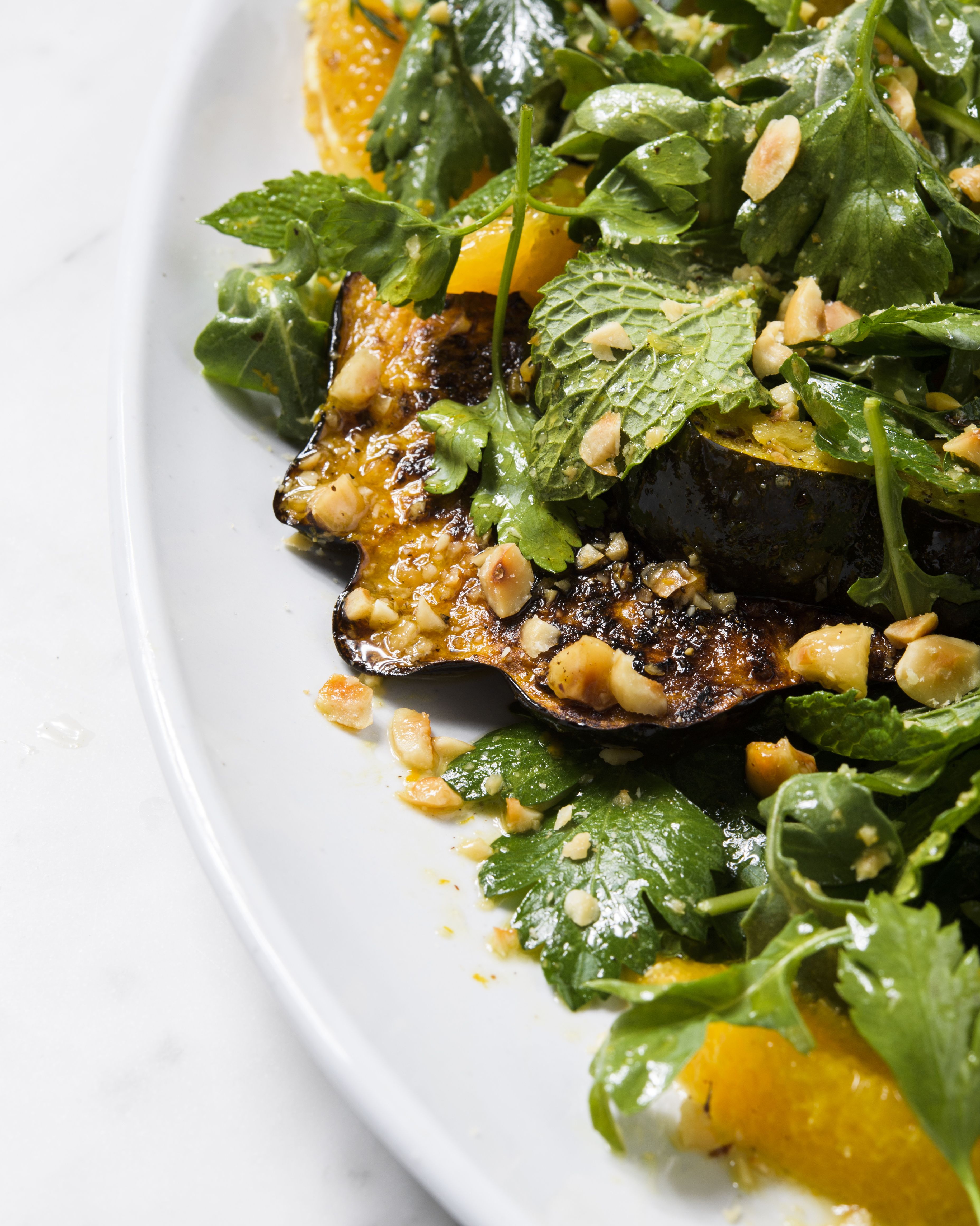 Roasted Acorn Squash with Orange-Herb Salad and Hazelnuts